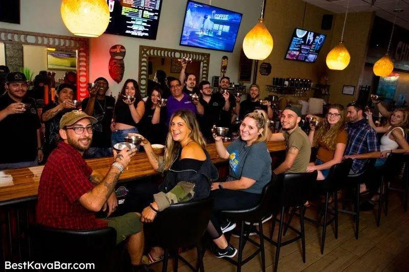 Group raising bowls together at the bar