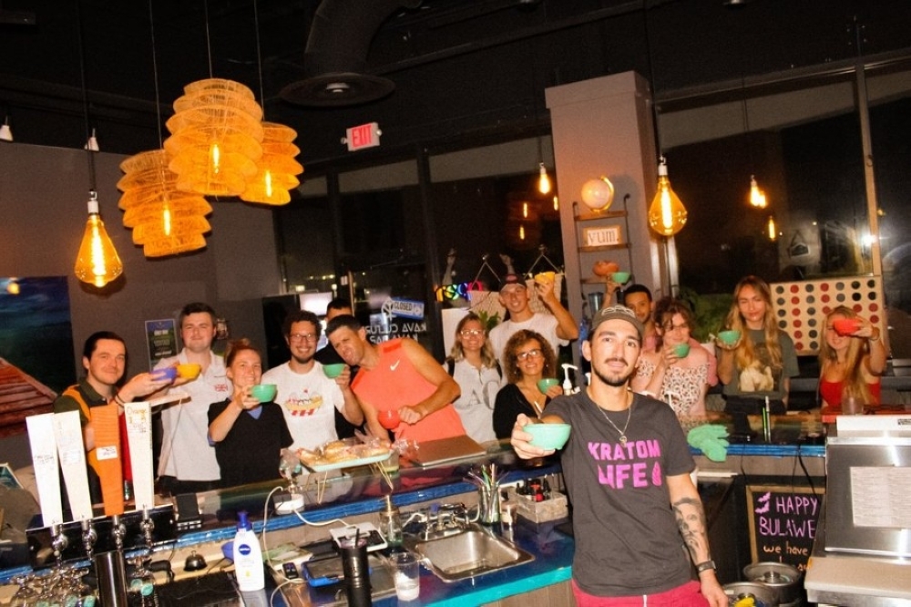 Bartender pouring for guests along the counter