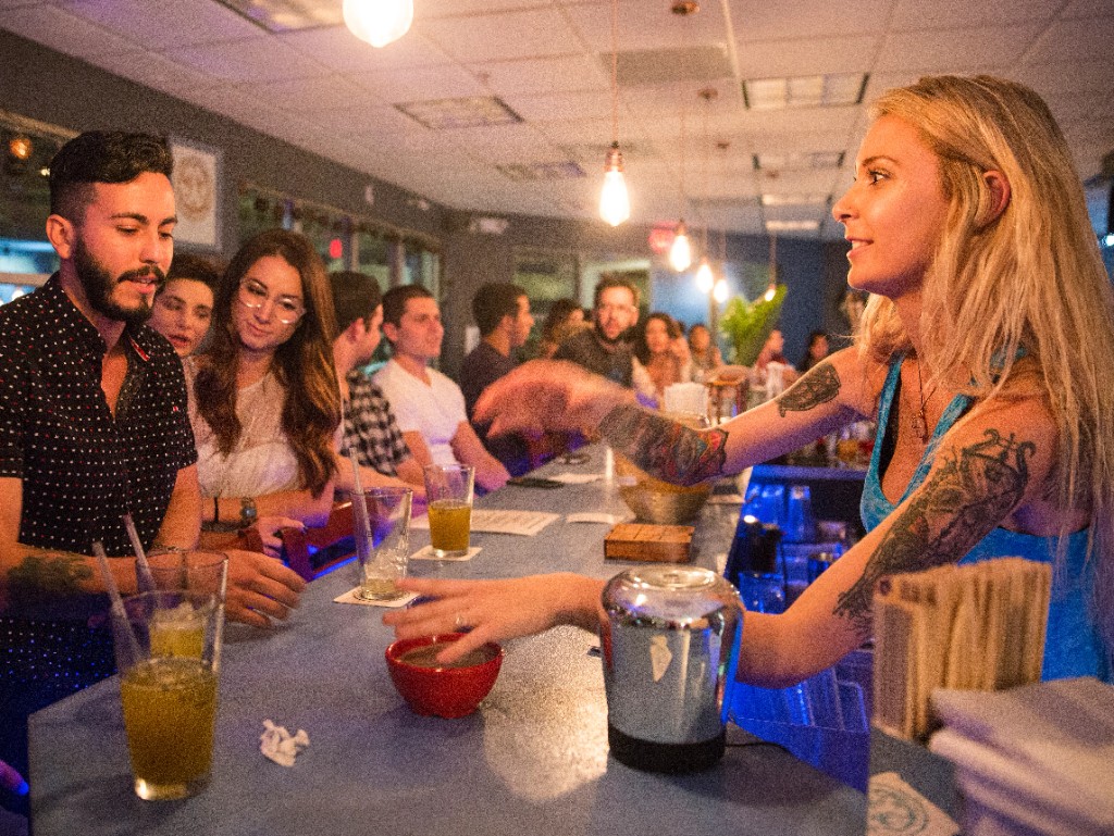 Colorful bowls raised in a celebratory moment